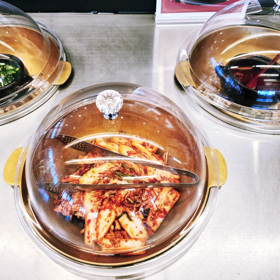 Kimchi and side dish station at the self-bar