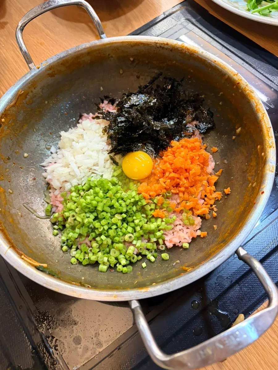 Kalguksu cooked in mushroom broth