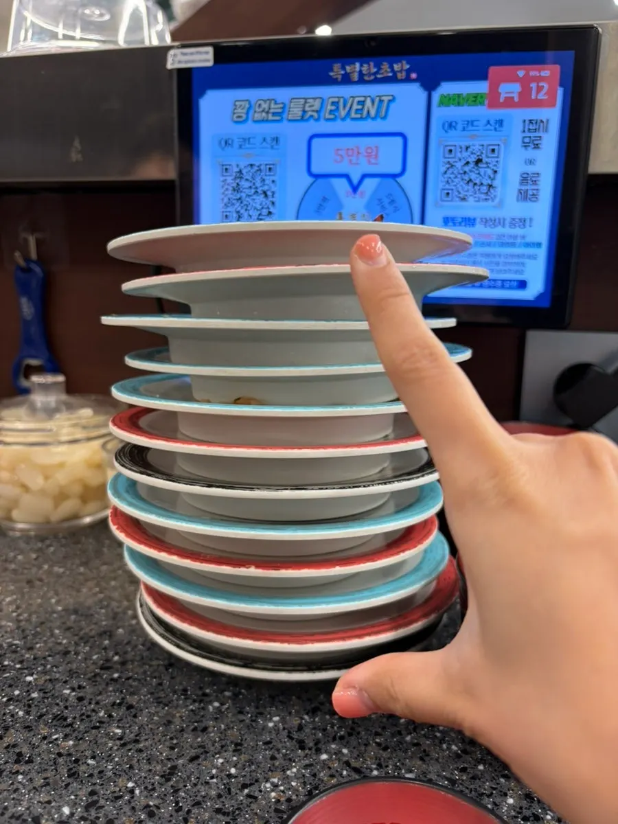 Empty sushi plates stacked on the table