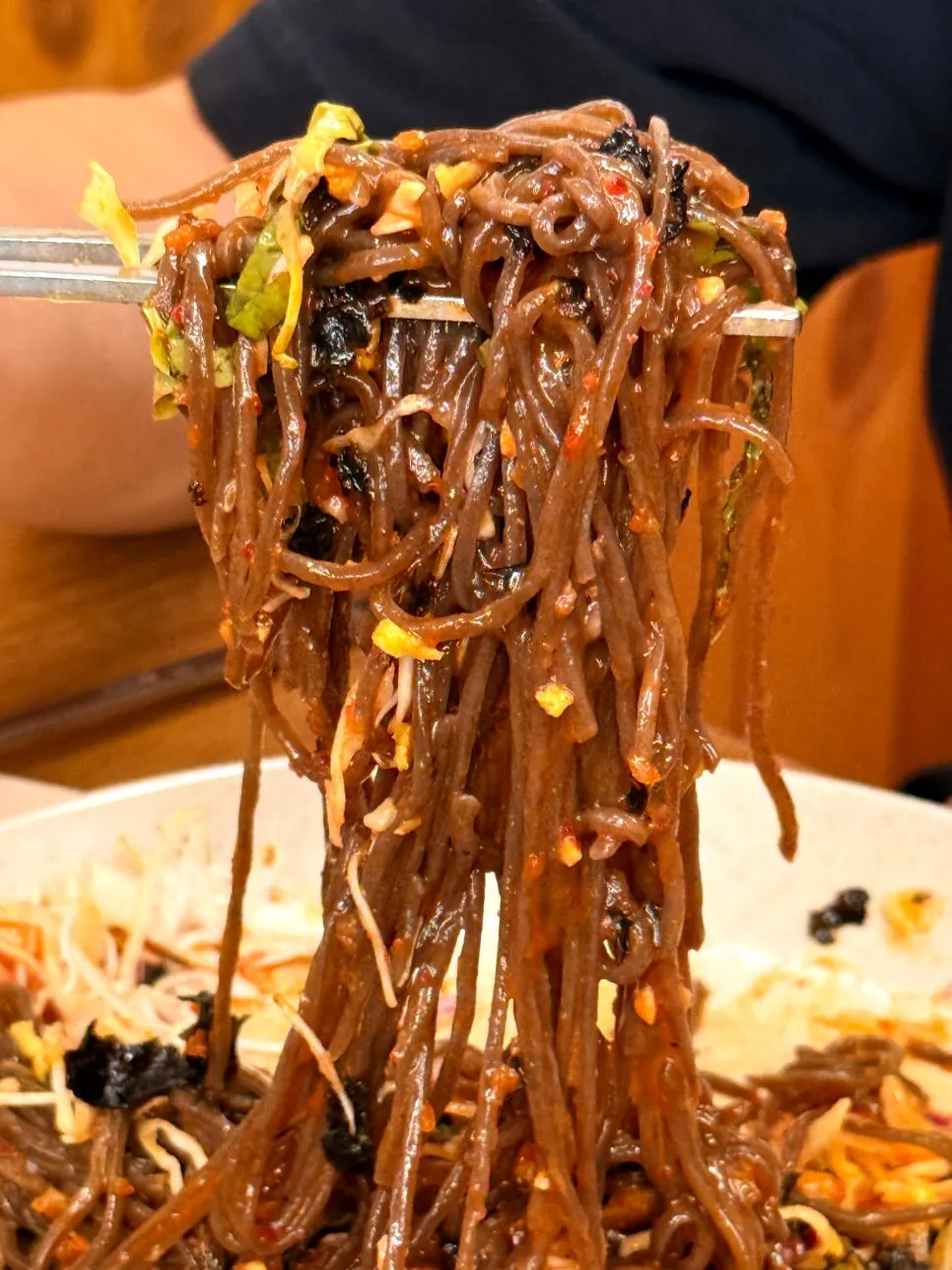 Noodle strands tossed in sauce for jaengban makguksu