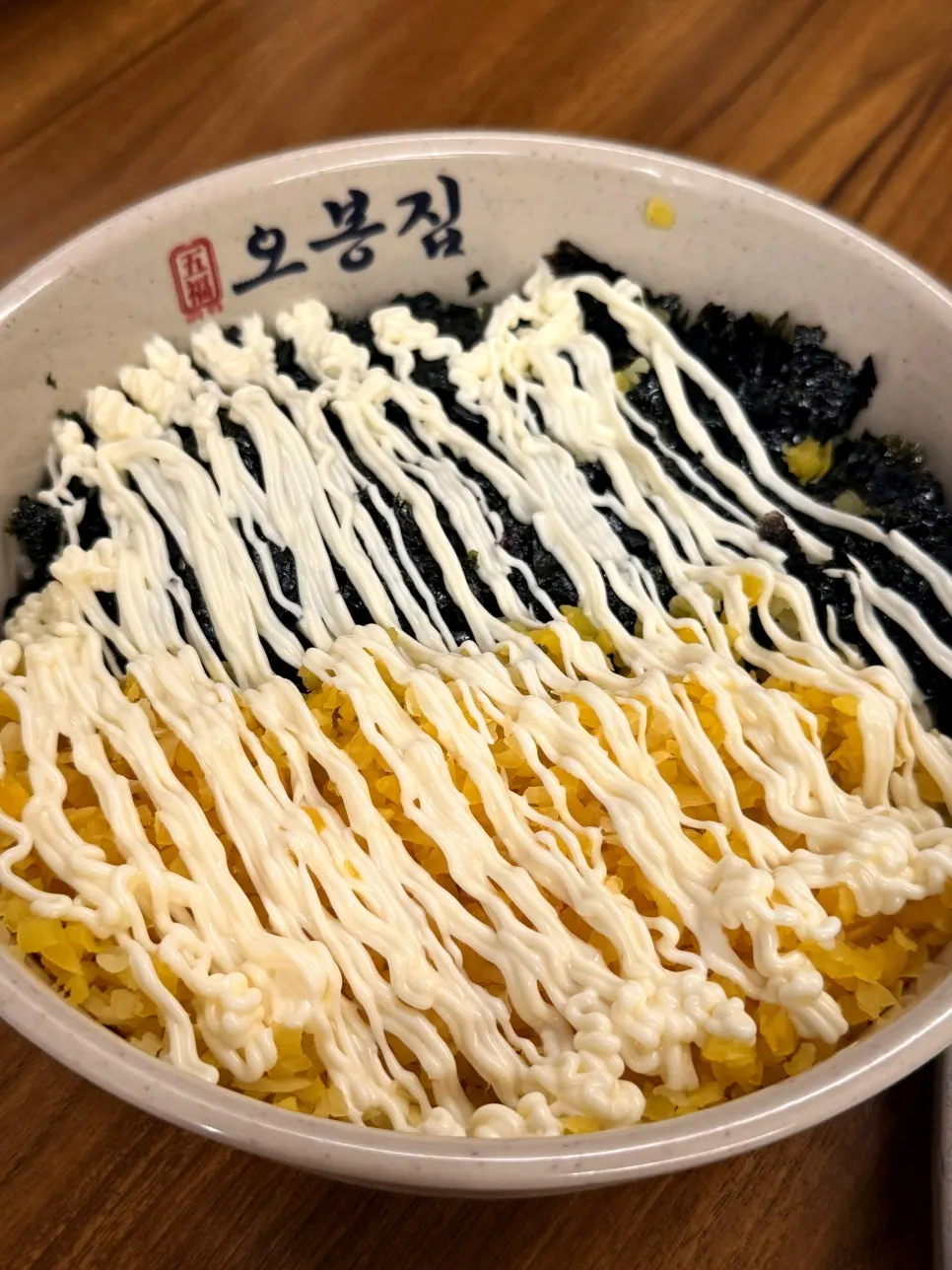 Rice ball with seaweed flakes and pickled radish