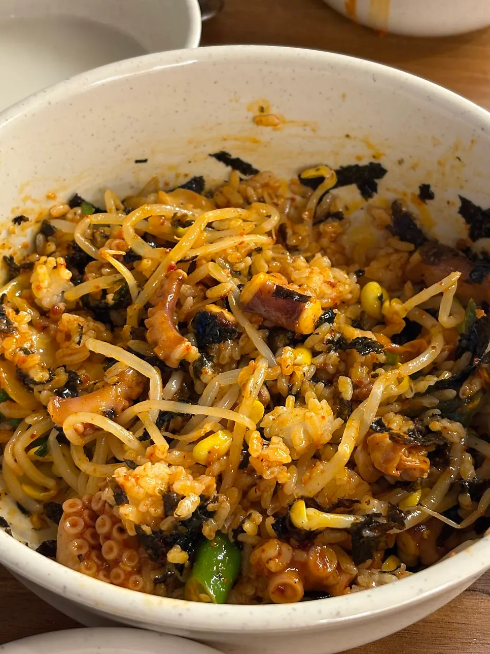 Octopus bibimbap with seaweed flakes and bean sprouts