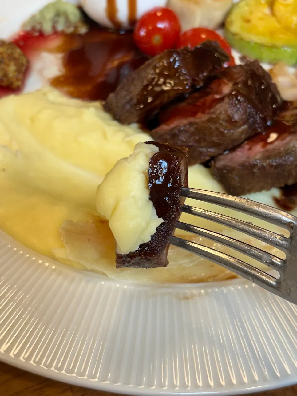Potato purée layered under the steak