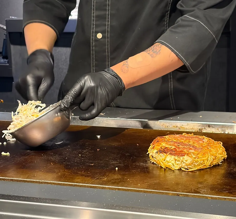 Chef cooking on the teppan