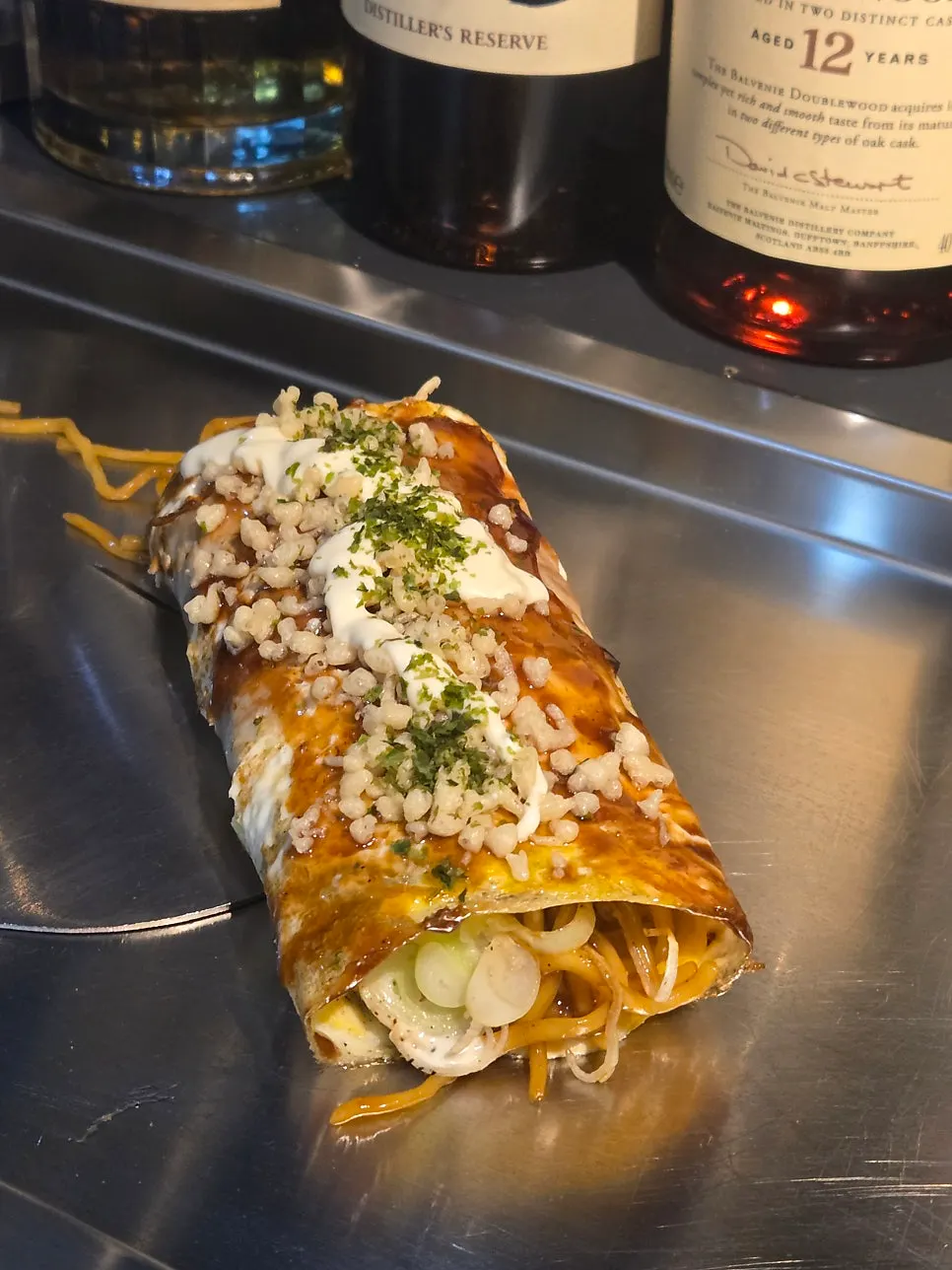 Close-up of the pork belly roll with cheese and egg
