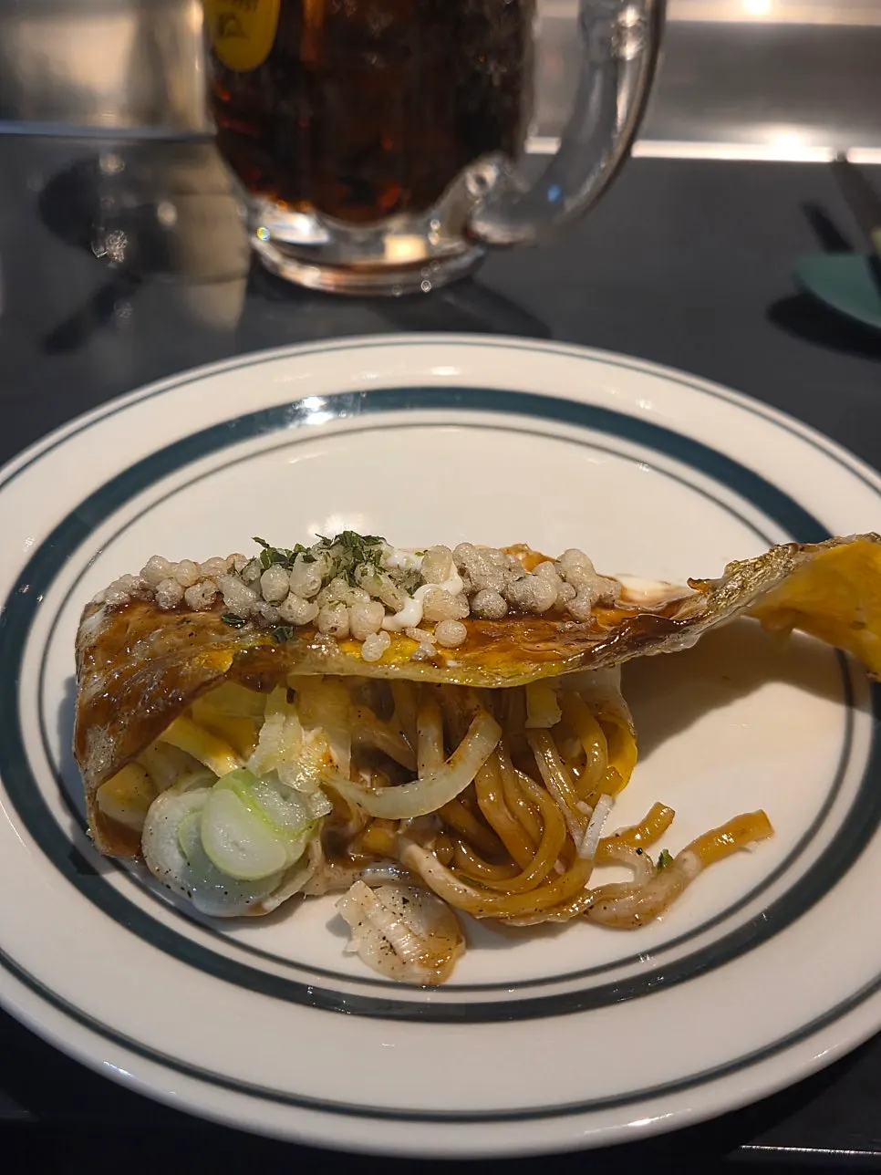 A bite-sized piece of the yakisoba pork belly roll
