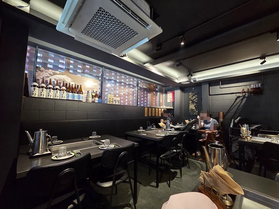 View of the restaurant with bar table and regular seating arranged