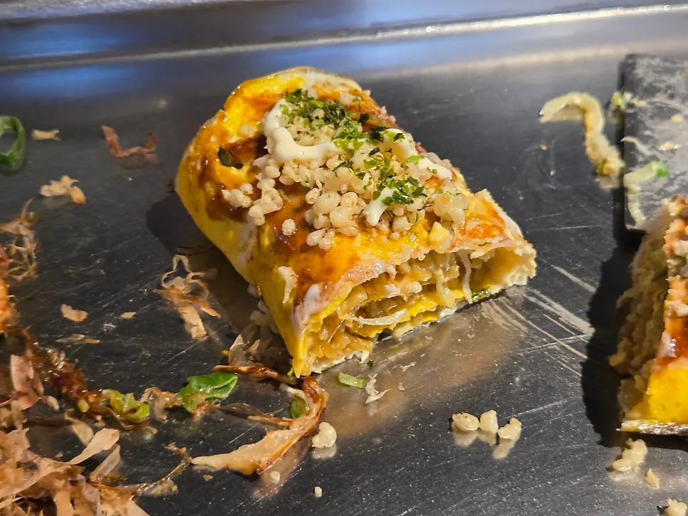 Yakisoba pork belly roll placed on the hot plate
