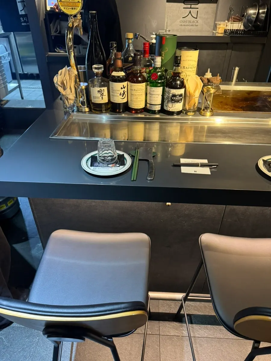 Teppanyaki dishes and draft beer laid out on the table