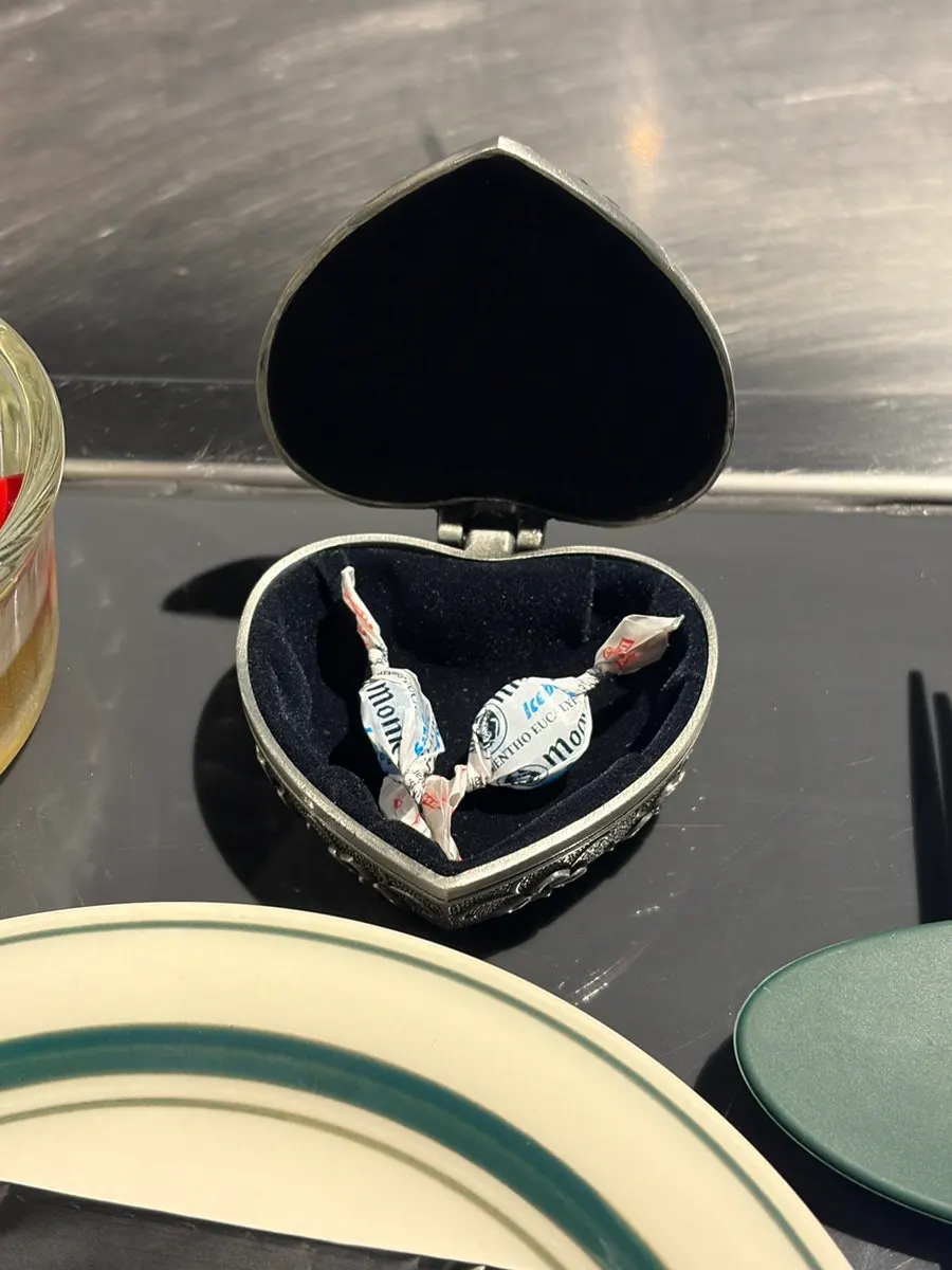 Mint candies in a heart-shaped case