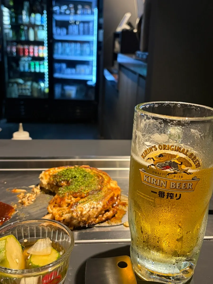 A piece of Oshi Modanyaki served on a small plate