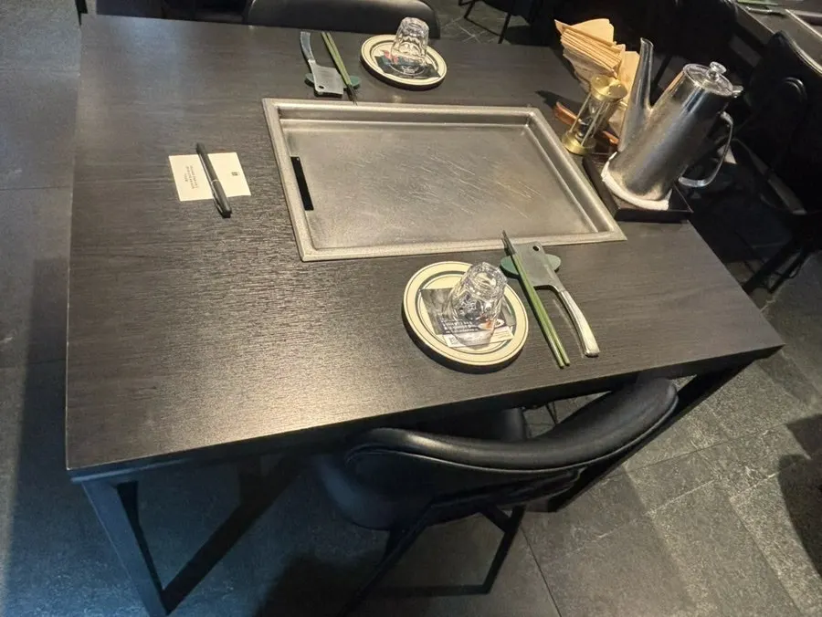 View of the dining hall with teppan tables and seating