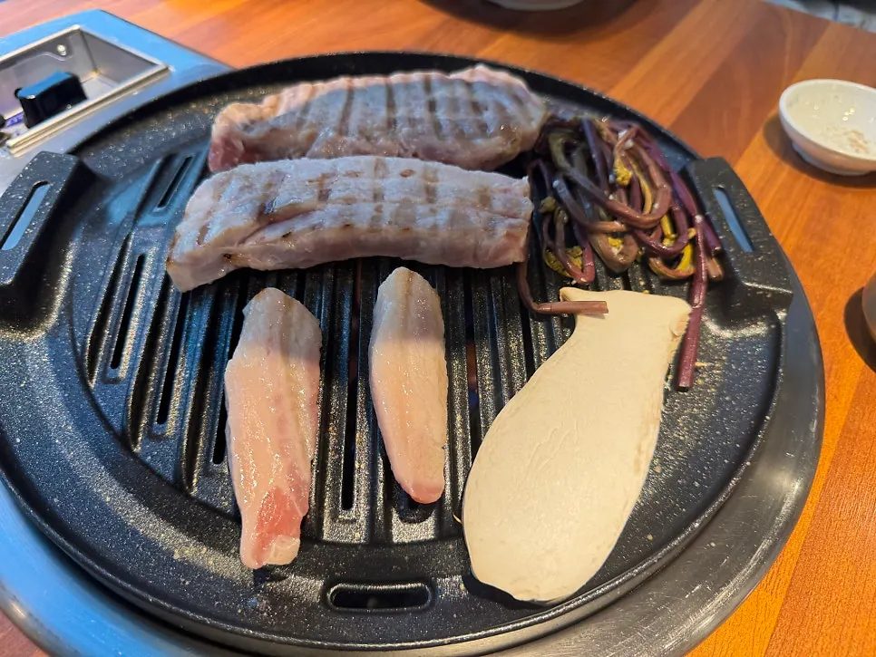 Thick-cut pork grilling on the grill