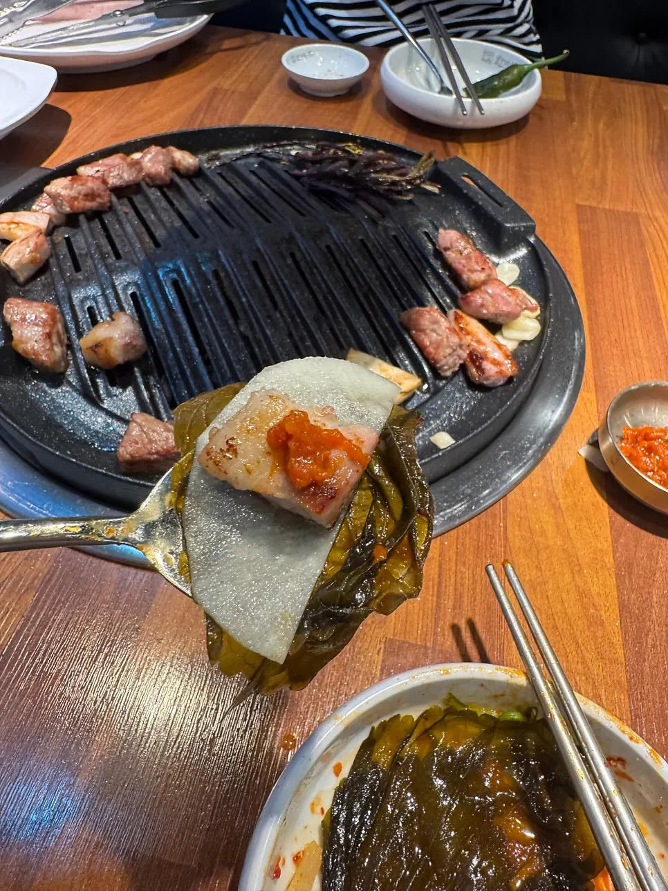 Grilled pork served as a lettuce wrap
