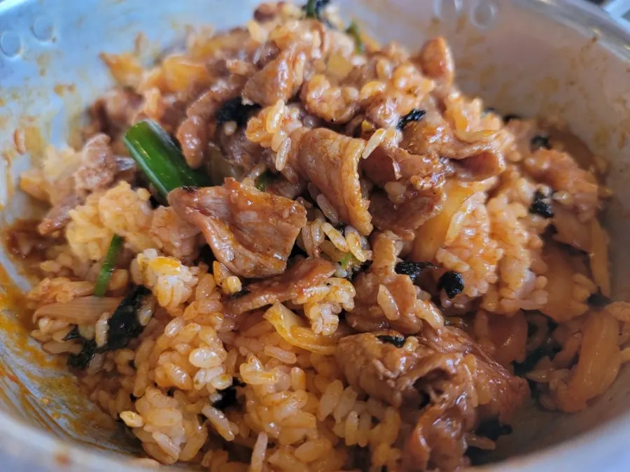 Spicy pork rice bowl topped with shredded seaweed