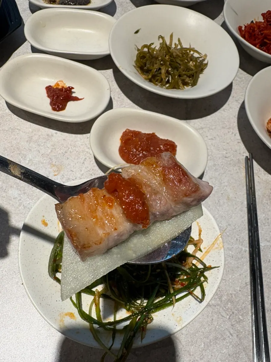 Black pork grilled meat dipped in sauce