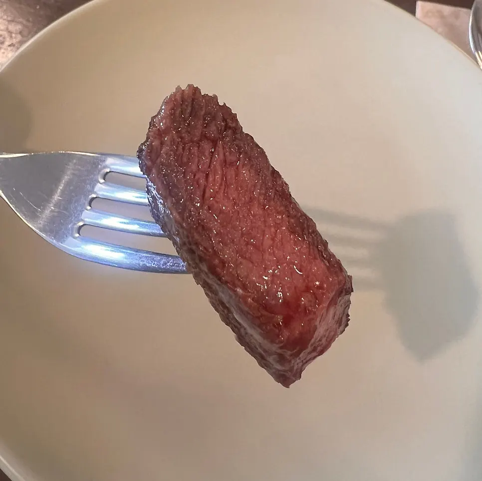 Cut house steak showing the juicy inside