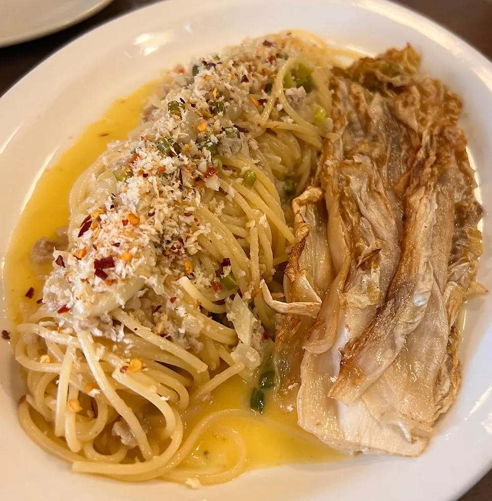 Signature aged kimchi pasta topped with grilled kimchi