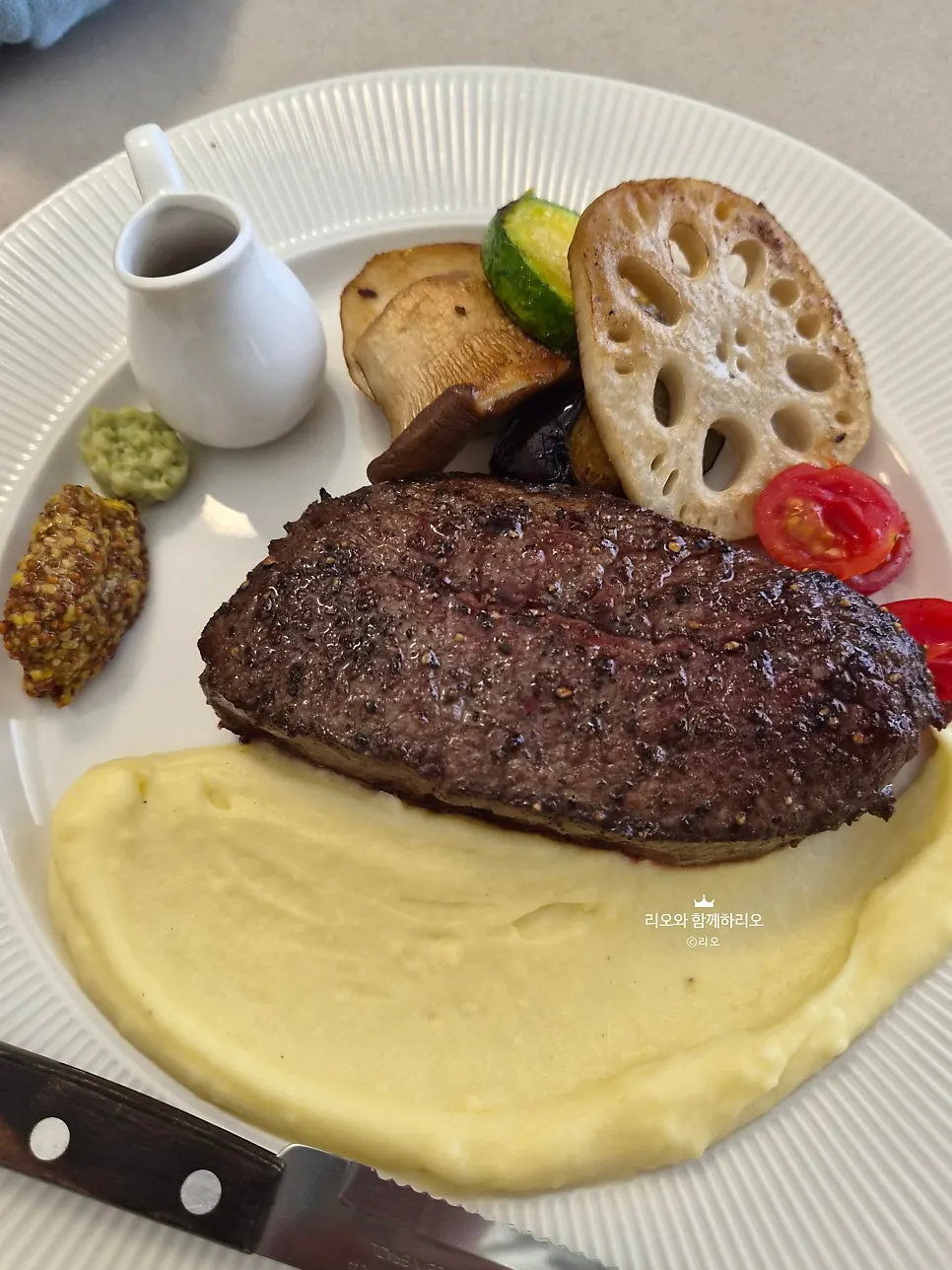 Oseuseu's house steak served with grilled vegetables