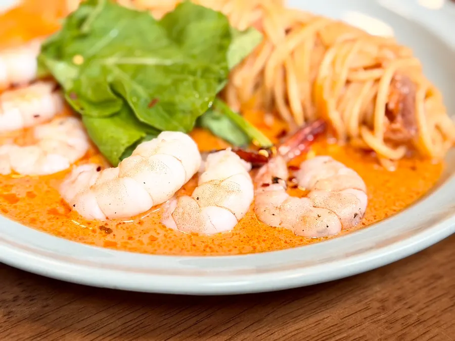 Noodles tossed in rosé sauce with shrimp