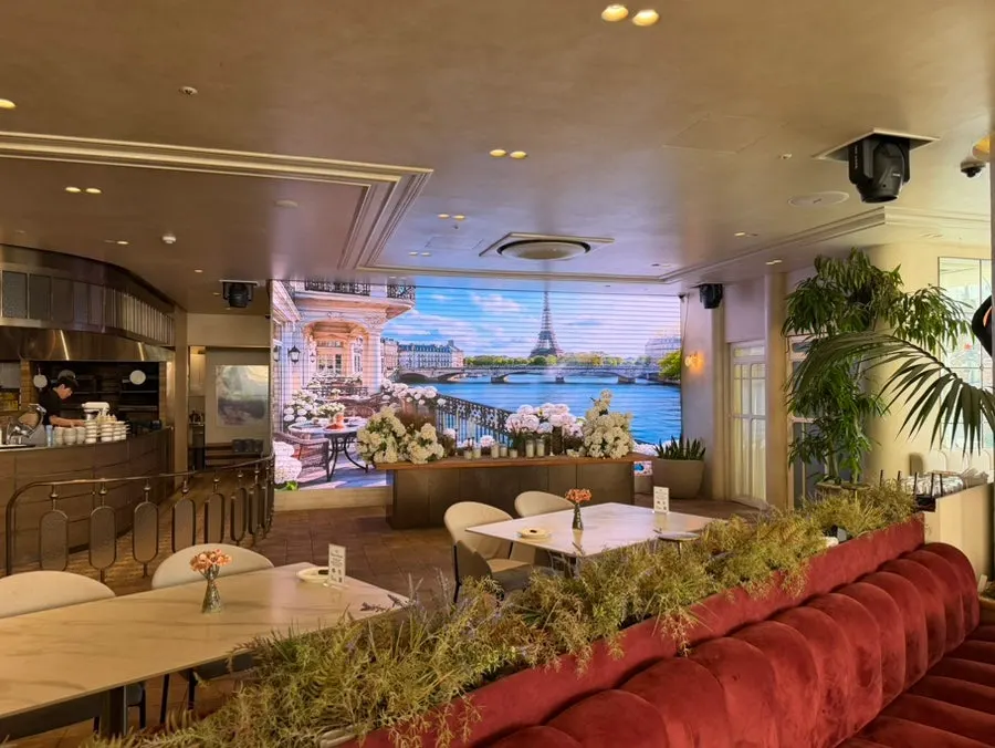 Interior of Osteria Eden decorated with plants