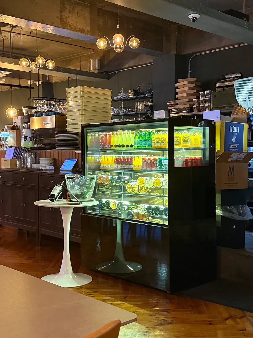 Wine bottles and glasses displayed inside Osteria Hyeon