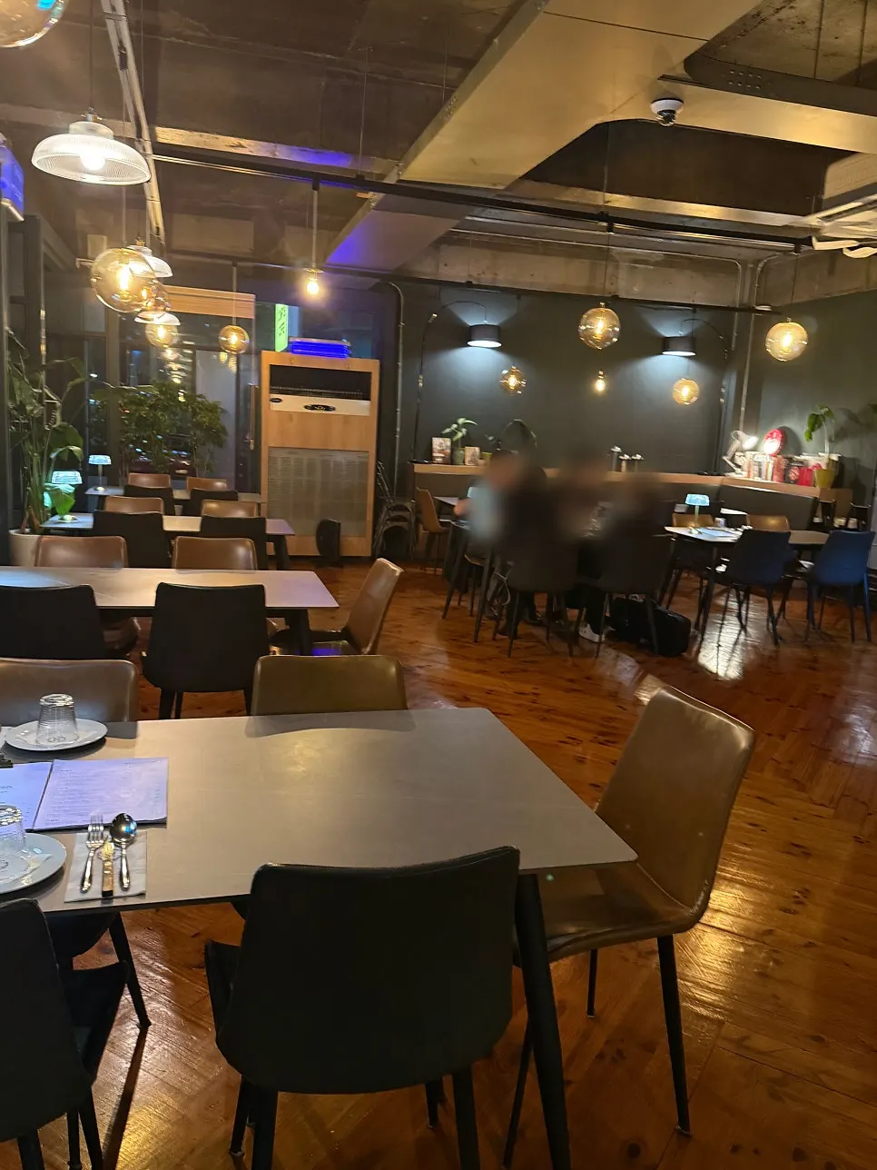 Outdoor terrace seating with open full-length windows
