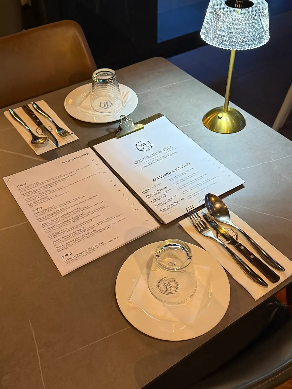 Osteria Hyeon's interior lit with warm lighting