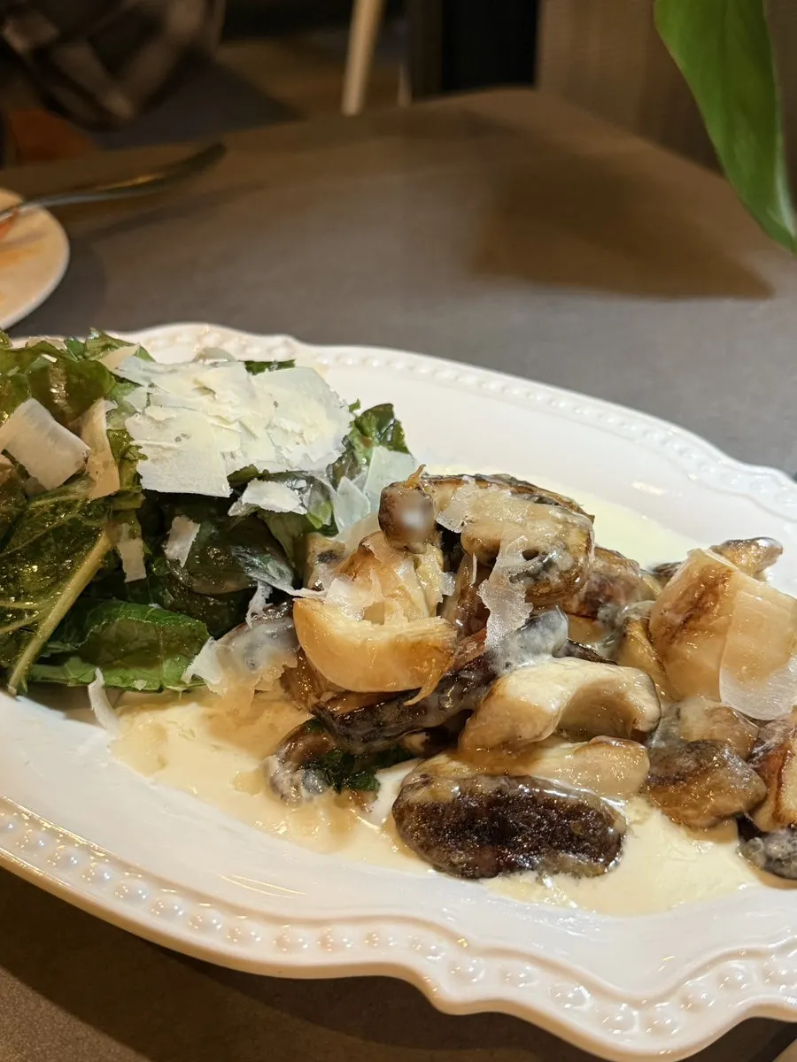 Close-up of the gorgonzola mushroom salad topped with cheese