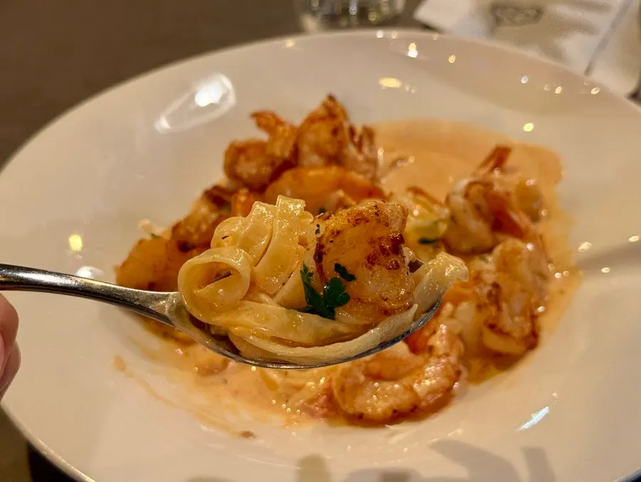 Crispy grilled shrimp on fresh pasta in rose sauce
