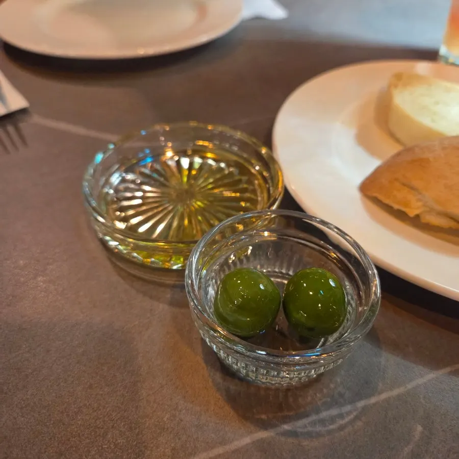 Green Castelvetrano olives served with bread