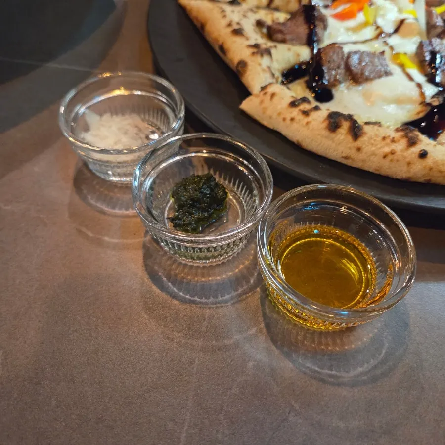 Korean beef tenderloin gorgonzola pizza and accompaniments