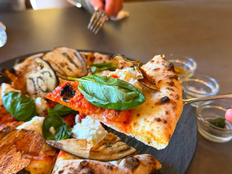 Osteria Hyeon pizza topped with eggplant and basil