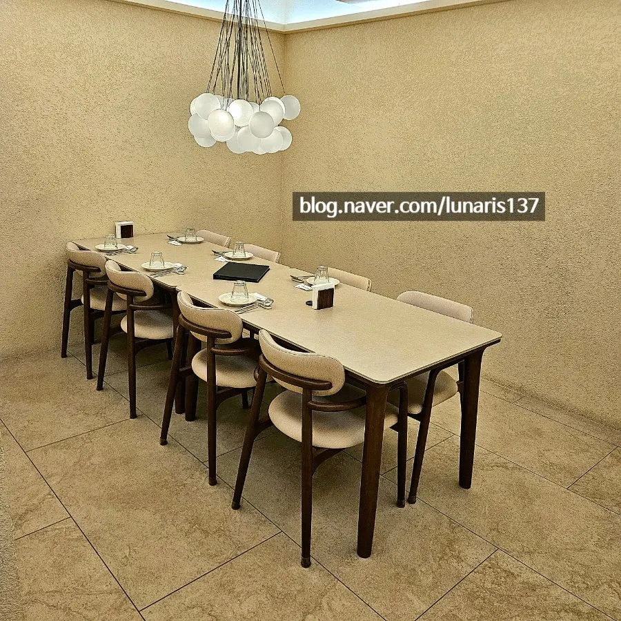 Window-side table seating with curtains