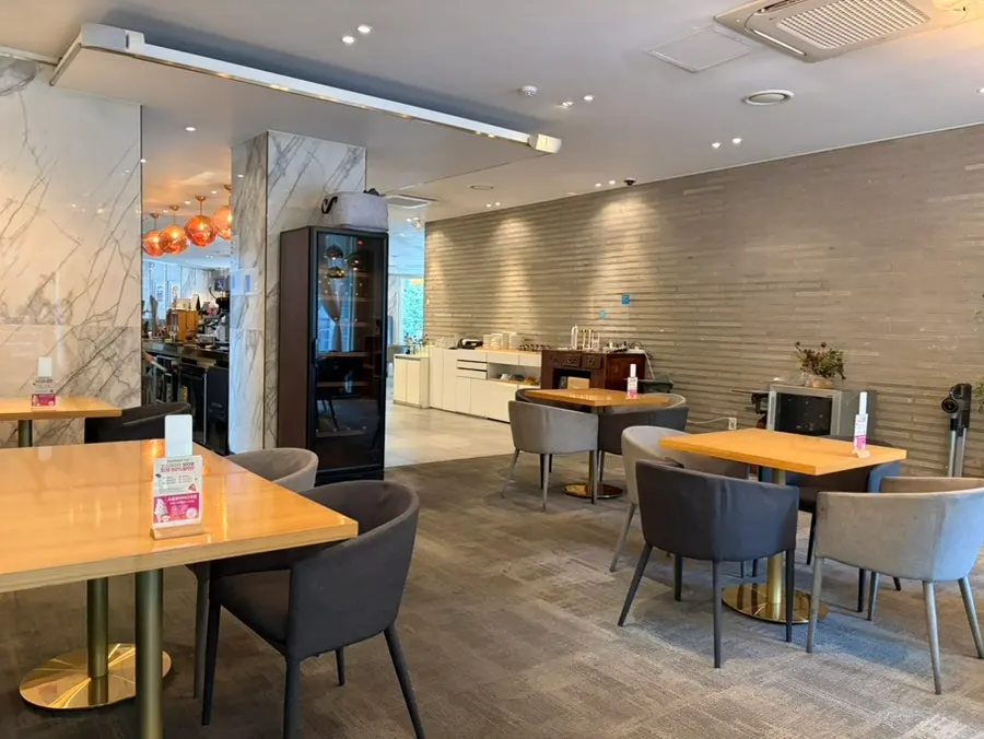 Spacious dining hall interior at Osteria Ottivo