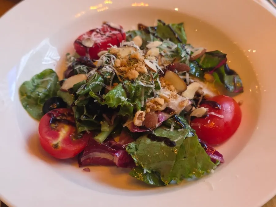 Close-up of salad topped with nuts and cheese