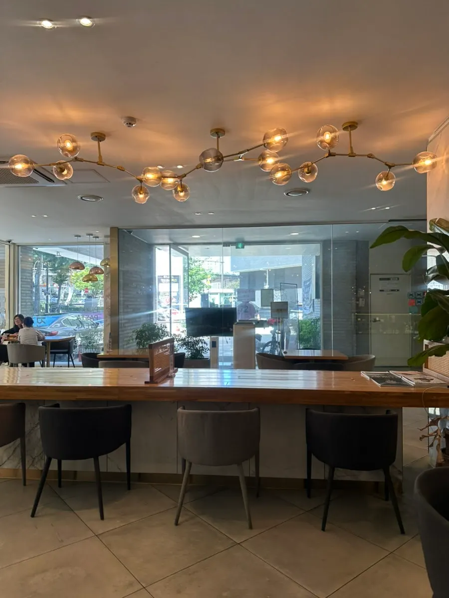 Osteria Ottivo dining hall with wide table spacing