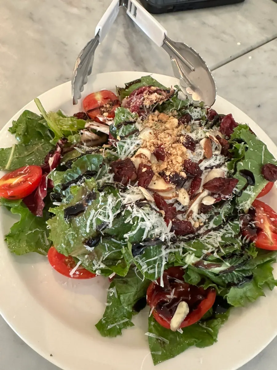 Generously portioned garden salad at Osteria Ottivo