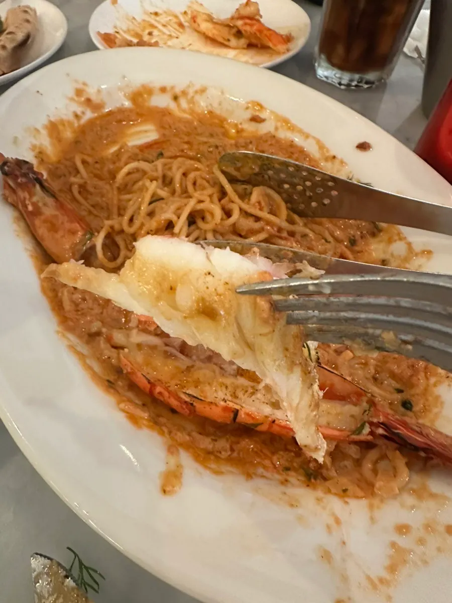 Noodles wrapped in thick bisque rosé sauce