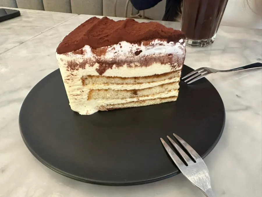 Tiramisu with a tasty sponge layer beneath the whipped cream