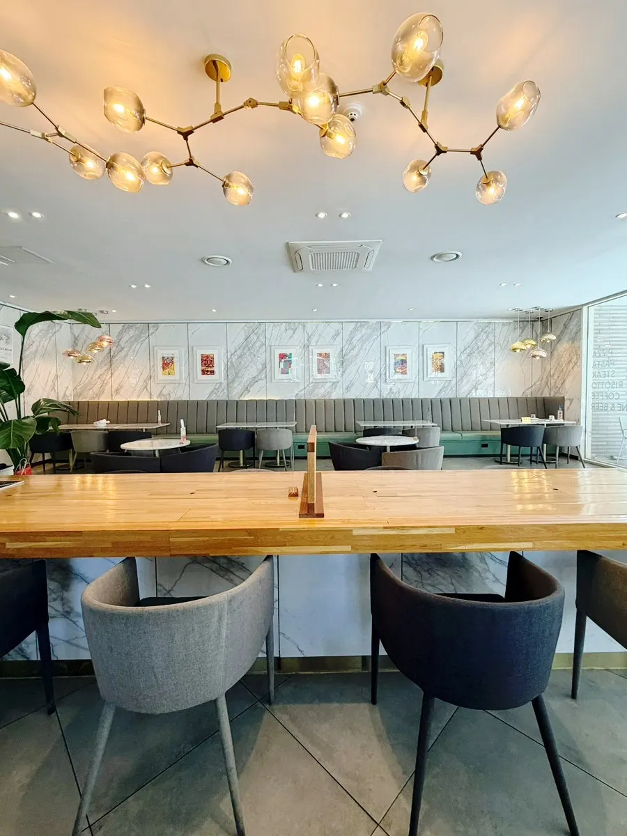 Interior view showing tables spaced comfortably apart