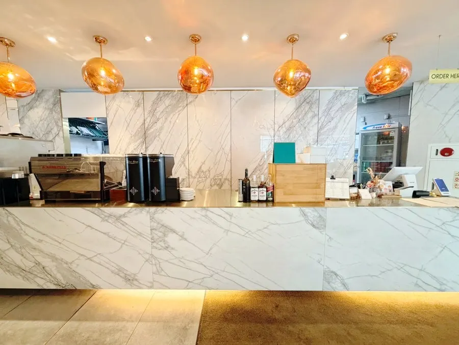 Kitchen and coffee bar at the center of the restaurant