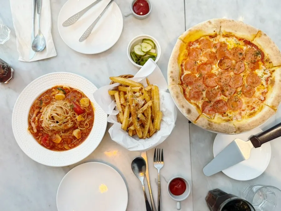 Pepperoni-topped pizza kept warm over a small flame