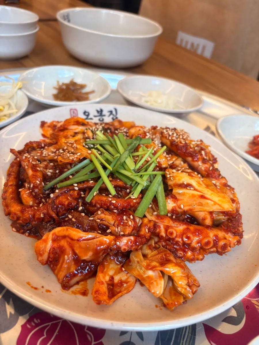 Table with fire-grilled octopus stir-fry and bossam