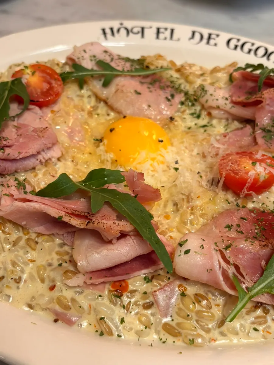 Jambon truffle cream risotto topped with egg yolk