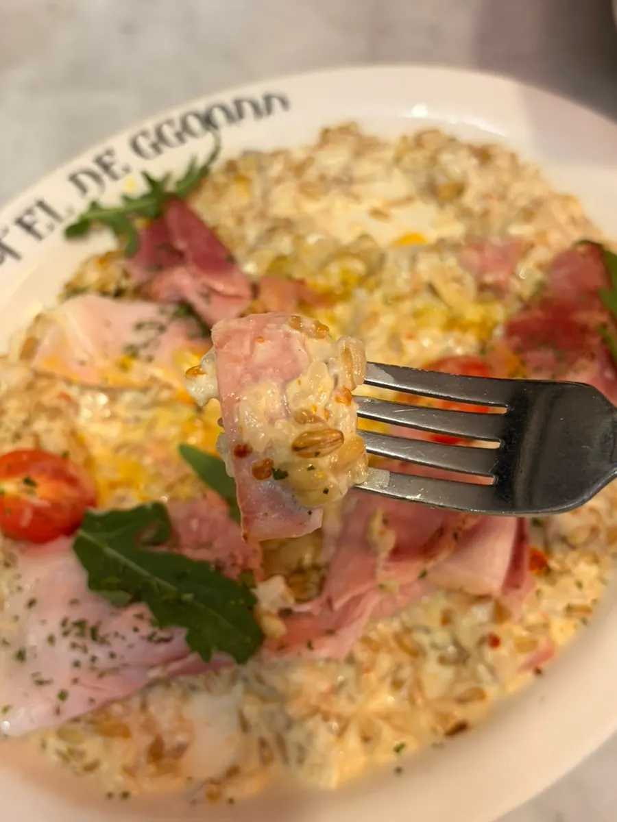 Risotto mixed with egg yolk and jambon