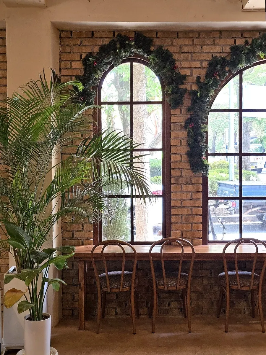 Tables spaced generously throughout the café