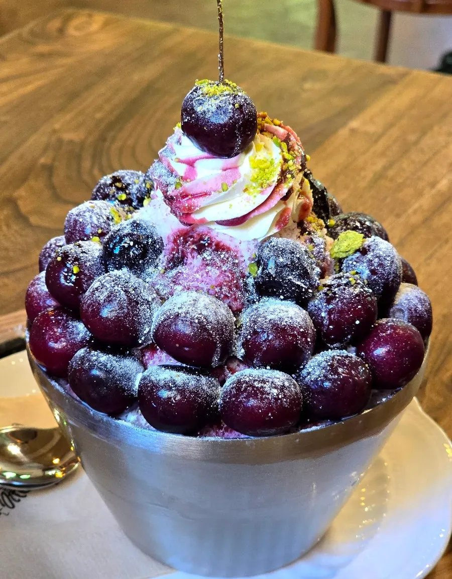 Milk snow ice topped with plenty of cherries