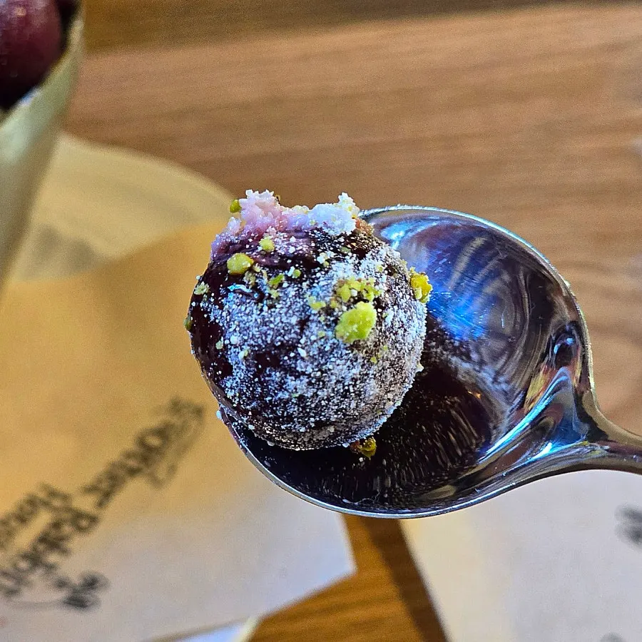 Mascarpone cream and crushed pistachios on the cherry bingsu