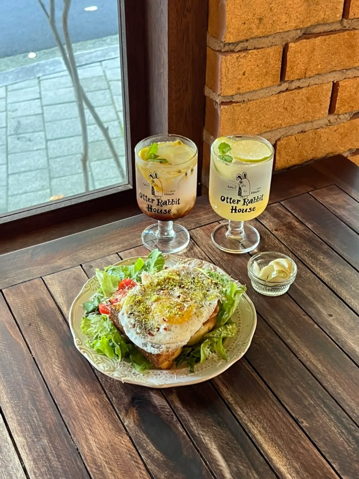 Egg basil French toast with two glasses of ade